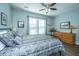 This comfortable bedroom has a ceiling fan and natural light from the window at 130 Darby Mdw Ln, Ridgeville, SC 29472