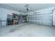 Spacious garage with ample storage solutions, organized shelving, and a clean, well-maintained floor at 130 Darby Mdw Ln, Ridgeville, SC 29472