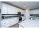Stylish kitchen featuring granite counters, stainless appliances, and ample cabinet space at 130 Darby Mdw Ln, Ridgeville, SC 29472