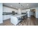 Bright kitchen featuring white cabinets, stainless steel appliances, and a spacious center island at 130 Darby Mdw Ln, Ridgeville, SC 29472