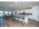 Open concept kitchen with a center island featuring seating and views of the dining area at 130 Darby Mdw Ln, Ridgeville, SC 29472