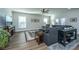Cozy living room with a large sectional sofa, stylish decor, and plenty of natural light at 130 Darby Mdw Ln, Ridgeville, SC 29472