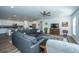 Comfortable living area with a spacious sectional sofa, ceiling fan, and hardwood floors at 130 Darby Mdw Ln, Ridgeville, SC 29472