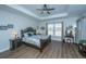 The main bedroom boasts a tray ceiling, ample natural light, and tastefully coordinated furnishings at 130 Darby Mdw Ln, Ridgeville, SC 29472