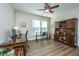 Inviting office space features a ceiling fan, hardwood floors, and a large hutch at 130 Darby Mdw Ln, Ridgeville, SC 29472