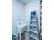 Functional utility sink in a room, accompanied by a ladder for convenient home maintenance tasks at 130 Darby Mdw Ln, Ridgeville, SC 29472