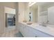 Spacious bathroom with double sinks, ample counter space, and a view into a well-organized closet at 130 River Landing Dr # 6207, Charleston, SC 29492