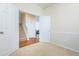 Spacious bedroom featuring neutral carpet and a doorway, creating a versatile and comfortable living space at 130 River Landing Dr # 6207, Charleston, SC 29492