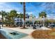 Community area with a grill, picnic tables, and outdoor games at 130 River Landing Dr # 6207, Charleston, SC 29492