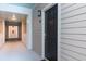 Apartment building exterior featuring a dark front door and hallway access at 130 River Landing Dr # 6207, Charleston, SC 29492