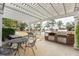 Outdoor grilling area featuring a built-in brick grill, picnic table, benches and a view of the pond at 130 River Landing Dr # 6207, Charleston, SC 29492