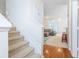 Bright, inviting interior featuring a staircase leading to a living area with comfortable seating and natural light at 130 River Landing Dr # 6207, Charleston, SC 29492