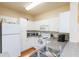 Well-equipped kitchen with white appliances, abundant cabinet space, and durable countertops for meal preparation at 130 River Landing Dr # 6207, Charleston, SC 29492