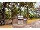 Outdoor grill area with a built-in brick grill and picnic table at 130 River Landing Dr # 6207, Charleston, SC 29492