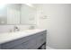 Bright bathroom featuring a double sink vanity with marble countertop and modern faucets at 130 River Landing Drive # 8209, Charleston, SC 29492