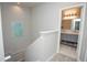 Well-lit bathroom entrance with double vanity, modern lighting, and neutral tones at 130 River Landing Drive # 8209, Charleston, SC 29492