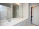 Bright bathroom with double sinks, a large mirror, white cabinets, and a shower with a curtain at 130 River Landing Drive # 8209, Charleston, SC 29492