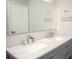 Bathroom boasts dual sinks with modern fixtures and a sleek marble countertop at 130 River Landing Drive # 8209, Charleston, SC 29492