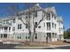 Multi-story apartment building with balconies and well-maintained landscaping at 130 River Landing Drive # 8209, Charleston, SC 29492