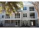 Exterior shot showcasing the building's balconies, screened-in porches, and multiple levels at 130 River Landing Drive # 8209, Charleston, SC 29492