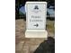 Daniel Island Ferry Landing sign with an arrow pointing towards the ferry, set on a brick surface at 130 River Landing Drive # 8209, Charleston, SC 29492