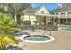 Relaxing hot tub and nearby lounge chairs for residents near community buildings at 130 River Landing Drive # 8209, Charleston, SC 29492