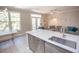 Open-concept kitchen area includes stainless appliances and a breakfast bar to the living area at 130 River Landing Drive # 8209, Charleston, SC 29492