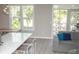 Open-concept living space with a kitchen and dining area flooded with natural light at 130 River Landing Drive # 8209, Charleston, SC 29492