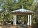 Outdoor pavilion with grill, perfect for gatherings, surrounded by lush greenery and mature trees, providing a serene setting at 130 River Landing Drive # 8209, Charleston, SC 29492