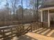 Well-maintained backyard with deck, swing set, and fire pit area perfect for outdoor entertaining at 132 Hidden Fawn Cir, Goose Creek, SC 29445