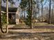 Secluded backyard featuring mature trees, a swing set, and a peaceful setting at 132 Hidden Fawn Cir, Goose Creek, SC 29445