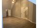Spacious bedroom with vaulted ceilings, wood floors, and two entry doors at 132 Hidden Fawn Cir, Goose Creek, SC 29445