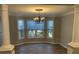 Bright dining room features luxury vinyl flooring, decorative columns and large windows at 132 Hidden Fawn Cir, Goose Creek, SC 29445