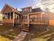 Charming two-story home with a screened porch and a backyard deck and stairs at 132 Hidden Fawn Cir, Goose Creek, SC 29445