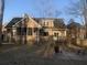 Charming home exterior with a screened porch, deck, and a spacious backyard at 132 Hidden Fawn Cir, Goose Creek, SC 29445