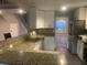 Modern kitchen with granite countertops, stainless steel appliances and eat-in bar at 132 Hidden Fawn Cir, Goose Creek, SC 29445
