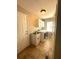 Bright laundry room includes a stainless steel sink, white cabinets, and a modern washer and dryer at 132 Hidden Fawn Cir, Goose Creek, SC 29445