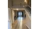 Open-concept living room with fireplace and view of staircase and balcony access at 132 Hidden Fawn Cir, Goose Creek, SC 29445