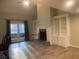 Bright living room featuring a fireplace, built-in shelves, and sliding glass doors to a balcony at 132 Hidden Fawn Cir, Goose Creek, SC 29445