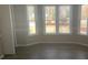 Bright living room with large windows and neutral decor create an inviting and open space at 132 Hidden Fawn Cir, Goose Creek, SC 29445