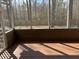 Relaxing screened porch providing an outdoor space with views of the wooded backyard at 132 Hidden Fawn Cir, Goose Creek, SC 29445