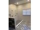 Modern shower with mixed pattern tiles and a window with white blinds at 132 Hidden Fawn Cir, Goose Creek, SC 29445