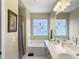 Bathroom featuring a double vanity, tub, and window at 138 Golfview Ln, Summerville, SC 29485