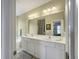 Bright bathroom with a white double vanity and a large mirror at 138 Golfview Ln, Summerville, SC 29485