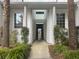 Inviting entrance with white pillars, lush landscaping, and clear unit number for easy identification at 138 Golfview Ln, Summerville, SC 29485