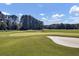 Scenic view of a well-maintained golf course with lush green grass and sand trap at 138 Golfview Ln, Summerville, SC 29485