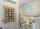 Hallway with a chairlift next to the staircase with a window for natural lighting at 138 Golfview Ln, Summerville, SC 29485