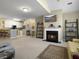 Open living area with a fireplace, integrated kitchen, and comfortable seating arrangement at 138 Golfview Ln, Summerville, SC 29485