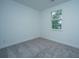 Bedroom with gray carpet, a window with blinds, and neutral-colored walls at 1402 Twin Rivers Dr, Wando, SC 29492
