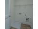 Laundry room with vinyl floors and a white wire shelf for added convenience at 1402 Twin Rivers Dr, Wando, SC 29492